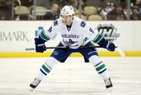 Jan 23, 2016; Pittsburgh, PA, USA; Vancouver Canucks center Jared McCann (91) prepares to take the opening face-off against the Pittsburgh Penguins during the first period at the CONSOL Energy Center. The Penguins won 5-4. Mandatory Credit: Charles LeClaire-USA TODAY Sports