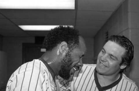 Milwaukee First baseman Cecil Cooper (L) is congratulated in the clubhouse by outfielder Mark Brouhard after the Milwaukee Brewers defeated the California Angels to win the American League pennant.Cooper’s key single in the seventh inning scored two runs to give the Brewers a 4-3 victory. (Photo by Bettmann Archive/Getty Images)