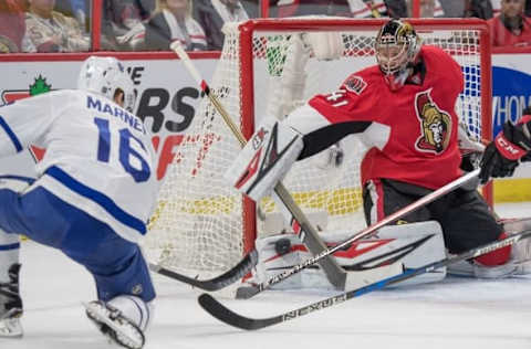 Oct 12, 2016; Ottawa, Ontario, CAN; Ottawa Senators goalie Craig Anderson (41) makes a save on a shot from Toronto Maple Leafs center Mitchell Marner (16) in the first period at Canadian Tire Centre. Mandatory Credit: Marc DesRosiers-USA TODAY Sports