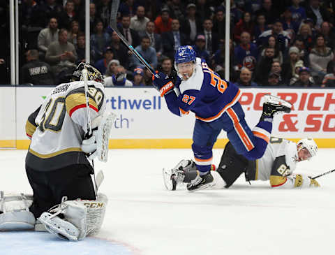 UNIONDALE, NEW YORK – DECEMBER 05: Anders Lee #27 of the New York Islanders takes the second period shot against Malcolm Subban #30 of the Vegas Golden Knights at NYCB Live’s Nassau Coliseum on December 05, 2019 in Uniondale, New York. (Photo by Bruce Bennett/Getty Images)