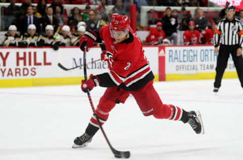 RALEIGH, NC – OCTOBER 30: Sebastian Aho #20 of the Carolina Hurricanes fires a slapshot during an NHL game against the Boston Bruins on October 30, 2018 at PNC Arena in Raleigh, North Carolina. (Photo by Gregg Forwerck/NHLI via Getty Images)