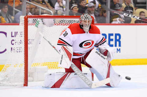 PITTSBURGH, PA – JANUARY 23: Carolina Hurricanes Goalie Cam Ward (30) makes a save during the second period in the NHL game between the Pittsburgh Penguins and the Carolina Hurricanes on January 23, 2018, at PPG Paints Arena in Pittsburgh, PA. (Photo by Jeanine Leech/Icon Sportswire via Getty Images)