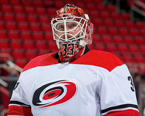 DETROIT, MI – FEBRUARY 24: Scott Darling #33 of the Carolina Hurricanes skates in warm-ups prior to an NHL game against the Detroit Red Wings at Little Caesars Arena on February 24, 2018 in Detroit, Michigan. The Wings defeated the Hurricanes 3-1. (Photo by Dave Reginek/NHLI via Getty Images)