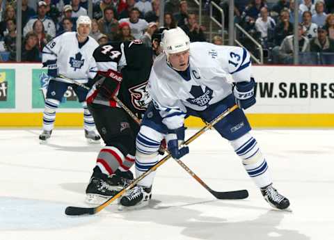 Mats Sundin #13 of the Toronto Maple Leafs battles Alexei Zhitnik #44 of the Buffalo Sabres at HSBC Arena in Buffalo, New York. (Photo by Rick Stewart/Getty Images)