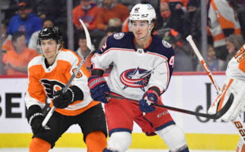 Jan 20, 2022; Philadelphia, Pennsylvania, USA; Columbus Blue Jackets center Alexandre Texier (42) battles for position with Philadelphia Flyers defenseman Travis Sanheim (6) during the first period at Wells Fargo Center. Mandatory Credit: Eric Hartline-USA TODAY Sports