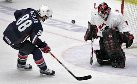 Leksand, SWEDEN: Team Canada’s goalie Carey Price saves the last shot from Team USA’s Peter Mueller (88) in the penalty shootout during the semifinal match USA vs Canada at the World U20 hockey championship 03 January 2007 in Leksand, Sweden. Canada won 2-3 and meets Sweden or Russia in final 05 January 2007. AFP PHOTO/SCANPIX/ANDERS WIKLUND (Photo credit should read ANDERS WIKLUND/AFP via Getty Images)