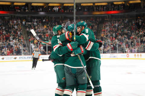 SAINT PAUL, MN – OCTOBER 20: (L-R) Zach Parise #11, Matt Dumba #24 and Mikko Koivu #9 of the Minnesota Wild celebrate after scoring a goal against the Montreal Canadiens during the game at the Xcel Energy Center on October 20, 2019, in Saint Paul, Minnesota. (Photo by Bruce Kluckhohn/NHLI via Getty Images)