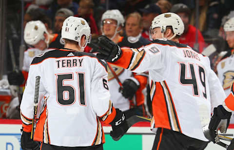 NEWARK, NJ – JANUARY 19: Troy Terry #61 of the Anaheim Ducks is congratulated by Max Jones #49 after scoring his first NHL goal against the New Jersey Devils during the game at Prudential Center on January 19, 2019, in Newark, New Jersey. (Photo by Andy Marlin/NHLI via Getty Images)