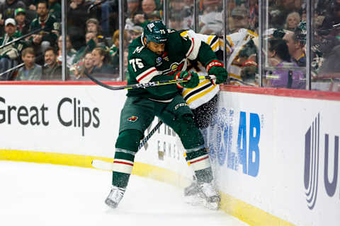 ST PAUL, MN – MARCH 18: Ryan Reaves #75 of the Minnesota Wild checks Matt Grzelcyk . (Photo by David Berding/Getty Images)