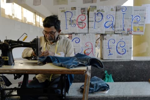 A tailor at a Repair Cafe in Bangalore, India in 2015