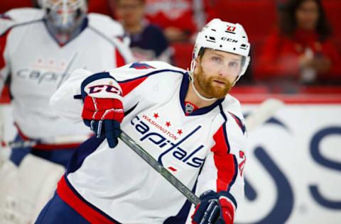 Dec 16, 2016; Raleigh, NC, USA; Washington Capitals defensemen Karl Alzner (27) passes the puck before the game against the Carolina Hurricanes at PNC Arena. The Washington Capitals defeated the Carolina Hurricanes 4-3 in the shoot out. Mandatory Credit: James Guillory-USA TODAY Sports