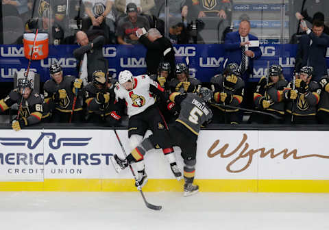 LAS VEGAS, NV – OCTOBER 17: Vegas Golden Knights defenseman Deryk Engelland (5) collides with Ottawa Senators left wing Nick Paul (13) during the first period of a regular season game between the Ottawa Senators and the Vegas Golden Knights Thursday, Oct. 17, 2019, at T-Mobile Arena in Las Vegas, Nevada. (Photo by: Marc Sanchez/Icon Sportswire via Getty Images)