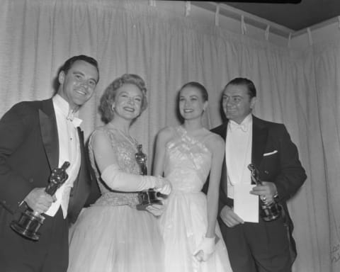 From left: Jack Lemmon (Best Supporting Actor winner for Mister Roberts), Jo Van Fleet (Best Supporting Actress winner for East of Eden), presenter Grace Kelly and Ernest Borgnine (Best Actor winner for Marty) pose with their Oscars, 1956.