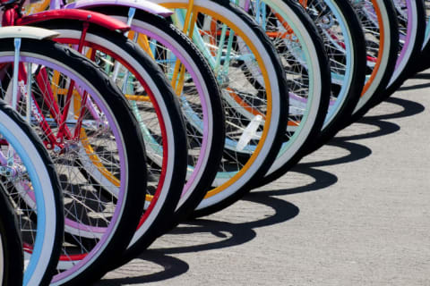 A series of colorful bike wheels.