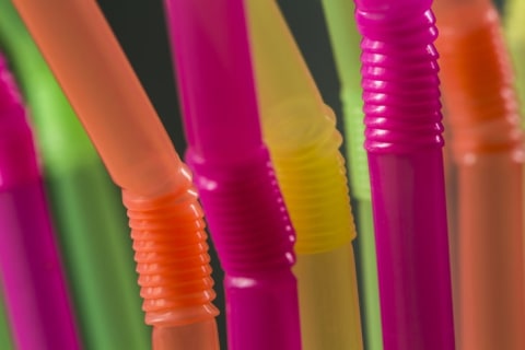 A close-up of colorful bendy straws.