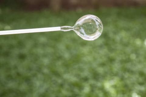 A bubble coming out of a straw.