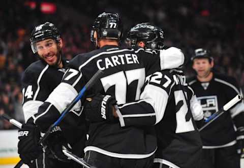 NHL Team Name Origins: Los Angeles Kings left wing Dwight King (74) and center Jeff Carter (77) celebrate the goal scored by defenseman Alec Martinez (27) against the Colorado Avalanche during the second period at Staples Center. Mandatory Credit: Gary A. Vasquez-USA TODAY Sports