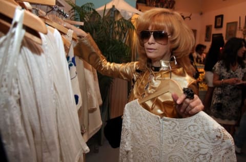 Linda Ramone browses vintage clothes in 2010.