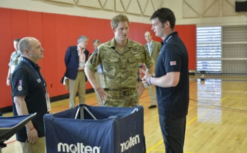 Prince Harry talks to a Warrior Games representative in the United States