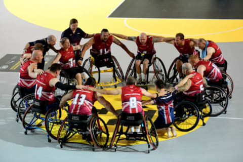 A group of athletes huddle during the Invictus Games