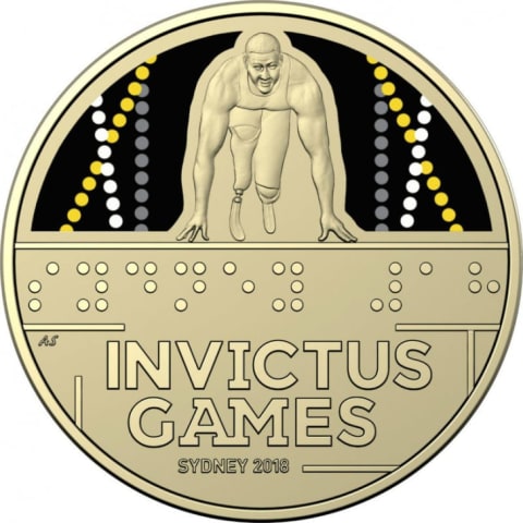 An Invictus Games commemorative coin features text in Braille