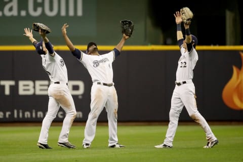 MILWAUKEE, WI – OCTOBER 19: Ryan Braun #8, Lorenzo Cain #6 and Christian Yelich #22 of the Milwaukee Brewers celebrate after defeating the Los Angeles Dodgers in Game Six of the National League Championship Series at Miller Park on October 19, 2018 in Milwaukee, Wisconsin. (Photo by Jonathan Daniel/Getty Images)