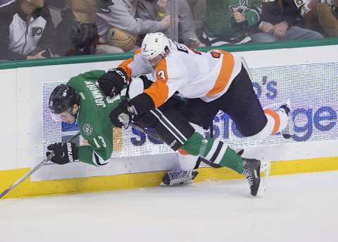 Dec 11, 2015; Dallas, TX, USA; Philadelphia Flyers defenseman Radko Gudas (3) checks Dallas Stars center Mattias Janmark (13) during the second period at the American Airlines Center. Mandatory Credit: Jerome Miron-USA TODAY Sports