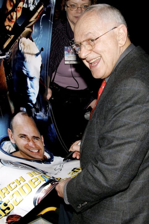 Former astronaut Alan Bean signs his photo in 2006.