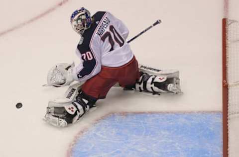 Aug 11, 2020; Toronto, Ontario, CAN; Columbus Blue Jackets goaltender Joonas Korpisalo (70) makes a save against the Tampa Bay Lightning in the second period in game one of the first round of the 2020 Stanley Cup Playoffs at Scotiabank Arena. Mandatory Credit: Dan Hamilton-USA TODAY Sports