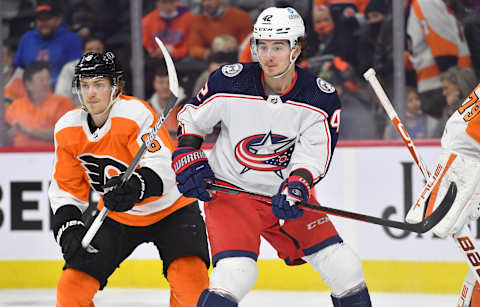 Jan 20, 2022; Philadelphia, Pennsylvania, USA; Columbus Blue Jackets center Alexandre Texier (42) battles for position with Philadelphia Flyers defenseman Travis Sanheim (6) during the first period at Wells Fargo Center. Mandatory Credit: Eric Hartline-USA TODAY Sports