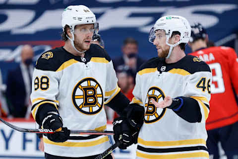 WASHINGTON, DC – MAY 15: David Pastrnak #88 (L) and David Krejci #46 of the Boston Bruins speak during the second period against the Washington Capitals during Game One of the First Round of the 2021 Stanley Cup Playoffs May 15, 2021, at Capital One Arena on May 15, 2021, in Washington, DC. (Photo by Tim Nwachukwu/Getty Images)