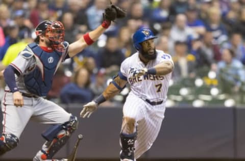 Apr 28, 2017; Milwaukee, WI, USA; Milwaukee Brewers first baseman Eric Thames (7) singles during the fifth inning against the Atlanta Braves at Miller Park. Mandatory Credit: Jeff Hanisch-USA TODAY Sports