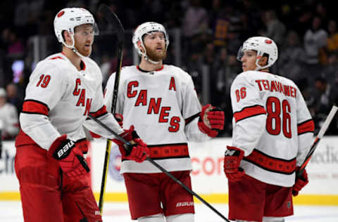 LOS ANGELES, CALIFORNIA – OCTOBER 15: Dougie Hamilton #19 and Jaccob Slavin #74 of the Carolina Hurricanes celebrate an empty net goal of Teuvo Teravainen #86 to take a 2-0 lead during the third period in a 2-0 Hurricanes win at Staples Center on October 15, 2019 in Los Angeles, California. (Photo by Harry How/Getty Images)