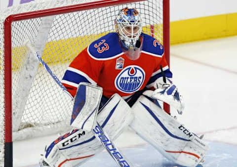 Oct 26, 2016; Edmonton, Alberta, CAN; Edmonton Oilers goaltender Cam Talbot (33) makes a save against warm-up against the Washington Capitals at Rogers Place. Mandatory Credit: Perry Nelson-USA TODAY Sports