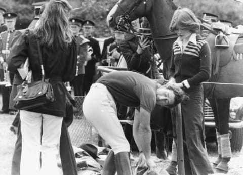 Prince Charles and Sarah Spencer (right, facing camera) on the sidelines after he played in an international polo match, July 1977.