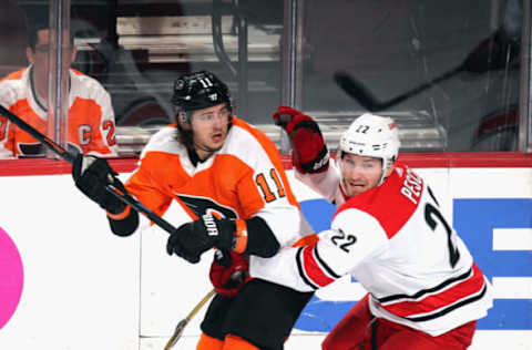 PHILADELPHIA, PENNSYLVANIA – APRIL 06: Brett Pesce #22 of the Carolina Hurricanes checks Travis Konecny #11 of the Philadelphia Flyers during the second period at the Wells Fargo Center on April 06, 2019 in Philadelphia, Pennsylvania. The Hurricanes defeated the Flyers 4-3. (Photo by Bruce Bennett/Getty Images)