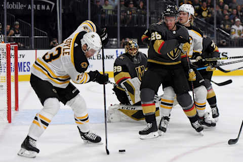 LAS VEGAS, NEVADA – OCTOBER 08: Charlie Coyle #13 of the Boston Bruins skates with the puck against Paul Stastny #26 of the Vegas Golden Knights in the first period of their game at T-Mobile Arena on October 8, 2019 in Las Vegas, Nevada. The Bruins defeated the Golden Knights 4-3. (Photo by Ethan Miller/Getty Images)