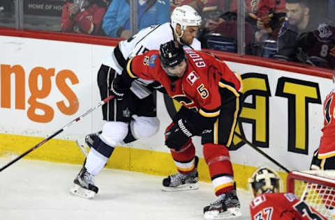 NHL Predictions: Calgary Flames defenseman Mark Giordano (5) collides with Los Angeles Kings left wing Andy Andreoff (15) at Scotiabank Saddledome. Kings won 5-4 in overtime. Mandatory Credit: Candice Ward-USA TODAY Sports