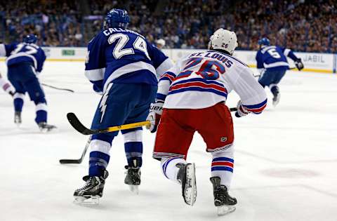 Ryan Callahan #24 of the Tampa Bay Lightning and Martin St. Louis #26 of the New York Rangers  (Photo by Mike Carlson/Getty Images)