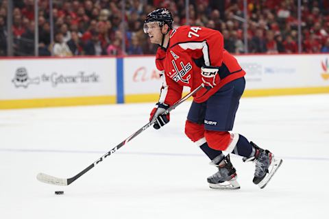 WASHINGTON, DC – DECEMBER 11: John Carlson #74 of the Washington Capitals shoots the puck against the Boston Bruins during the second period at Capital One Arena on December 11, 2019 in Washington, DC. (Photo by Patrick Smith/Getty Images)