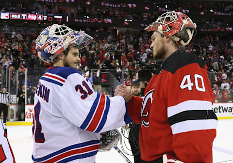 Igor Shesterkin of the Rangers congratulates Akira Schmid of the Devils. (Photo by Bruce Bennett/Getty Images)