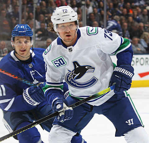 Tyler Toffoli of the Vancouver Canucks skates against Zach Hyman. (Photo by Claus Andersen/Getty Images)