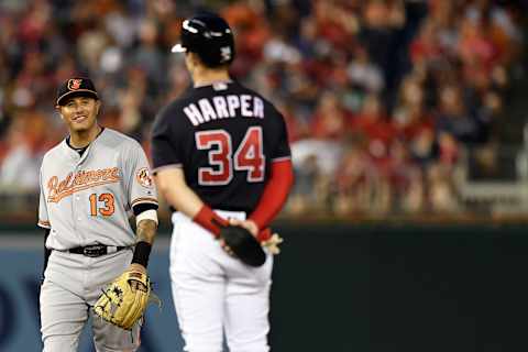 WASHINGTON, DC – JUNE 19: Bryce Harper #34 of the Washington Nationals talks with Manny Machado #13 of the Baltimore Orioles after hitting a RBI double in the fifth inning at Nationals Park on June 19, 2018 in Washington, DC. (Photo by Patrick McDermott/Getty Images)