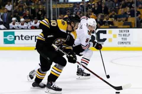 BOSTON, MA – SEPTEMBER 25: Boston Bruins left wing Anders Bjork (10) moves past Chicago Blackhawks defenseman Connor Murphy (5) during a preseason game between the Boston Bruins and the Chicago Blackhawks on September 25, 2017, at TD Garden in Boston, Massachusetts. (Photo by Fred Kfoury III/Icon Sportswire via Getty Images)