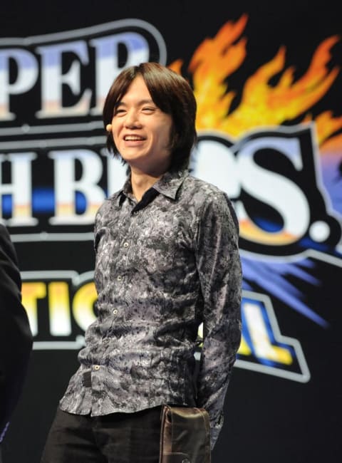 Masahiro Sakurai, creator and director of Nintendo's Super Smash Bros. series, welcomes the crowd at an event in 2014.