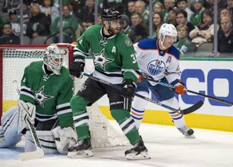 Jan 21, 2016; Dallas, TX, USA; Dallas Stars goalie Antti Niemi (31) and defenseman Alex Goligoski (33) defend against Edmonton Oilers center Matt Hendricks (23) during the first period at the American Airlines Center. Mandatory Credit: Jerome Miron-USA TODAY Sports