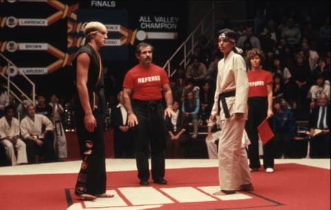 Ralph Macchio, Pat Morita, Randee Heller, Pat E. Johnson, and William Zabka in The Karate Kid (1984).