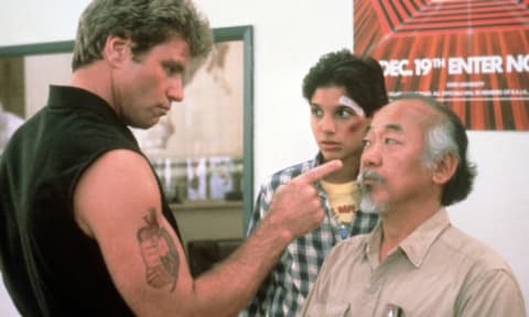 Martin Kove, Ralph Macchio, and Pat Morita in The Karate Kid (1984).