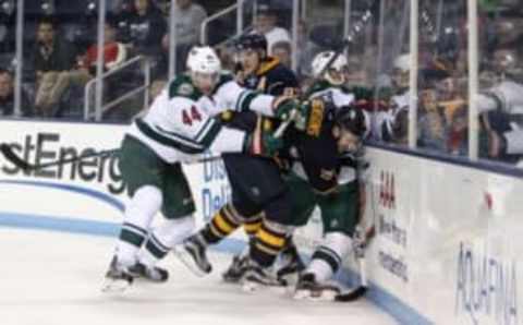 Sep 26, 2016; State College, PA, USA; Buffalo Sabres forward Zemgus Girgensons (28) is checked by Minnesota Wild forward Tyler Graovac (44) during the second period in a preseason hockey game at Pegula Ice Arena. Mandatory Credit: Matthew O