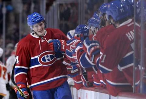 Mar 20, 2016; Montreal, Quebec, CAN; Montreal Canadiens forward Michael McCarron (34) celebrates with teammates after scoring a goal against the Calgary Flames during the third period at the Bell Centre. It was McCarron